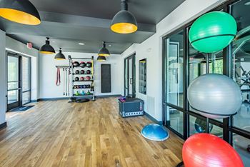 a room filled with furniture and a large window at The Livano Tryon, Charlotte, North Carolina